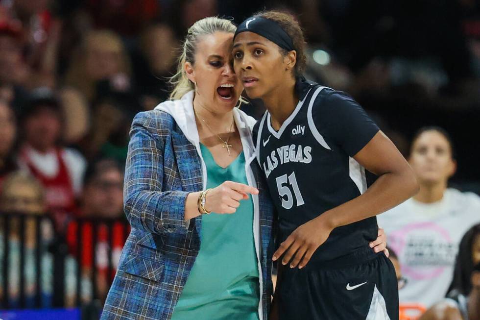 Aces head coach Becky Hammon coaches Aces guard Sydney Colson (51) during a WNBA basketball ga ...