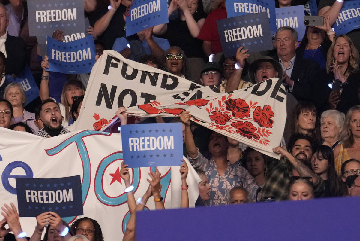 Protesters display a banner as Democratic presidential nominee Vice President Kamala Harris&#xa ...