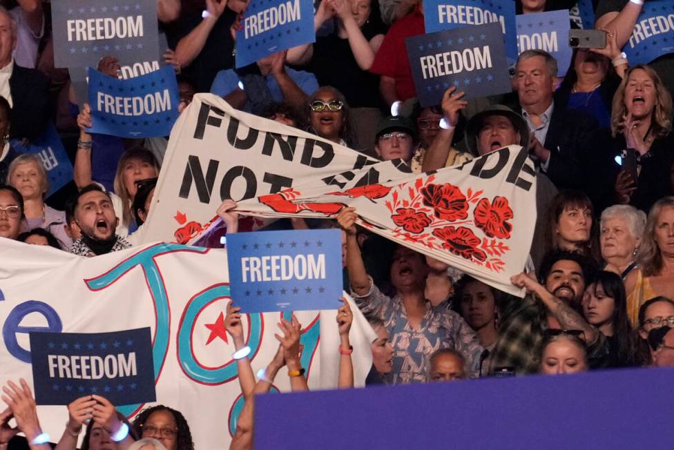 Protesters display a banner as Democratic presidential nominee Vice President Kamala Harris&#xa ...