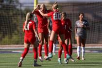 Coronado’s Allison Kleiner, center left, and Cate Gusick (20) celebrate Kleiner’s ...