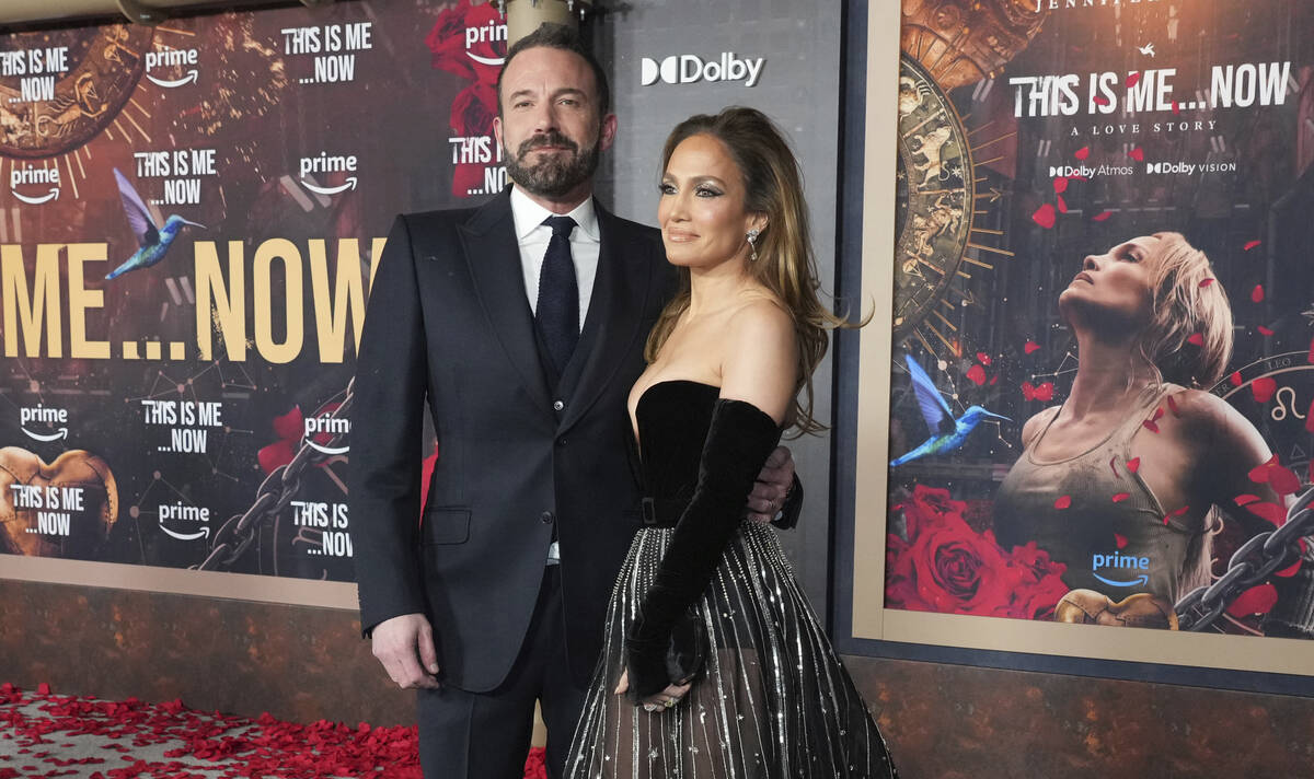 Ben Affleck, left, and Jennifer Lopez arrive at the premiere of "This Is Me... Now: A Love Stor ...