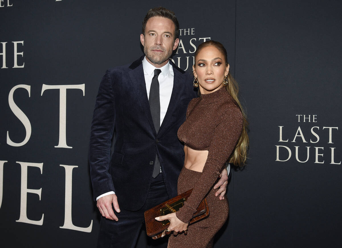 Actor Ben Affleck, left, and actor-singer Jennifer Lopez attend the premiere of "The Last Duel" ...