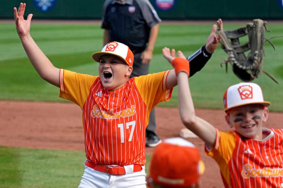 Boerne, Texas' Cooper Hastings (17) celebrates with teammates after getting the final out of a ...