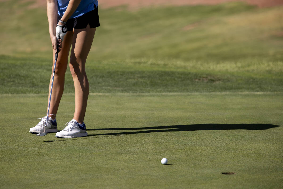 Centennial’s Mia Meyers putts the ball during the 5A Desert League girls golf match at T ...