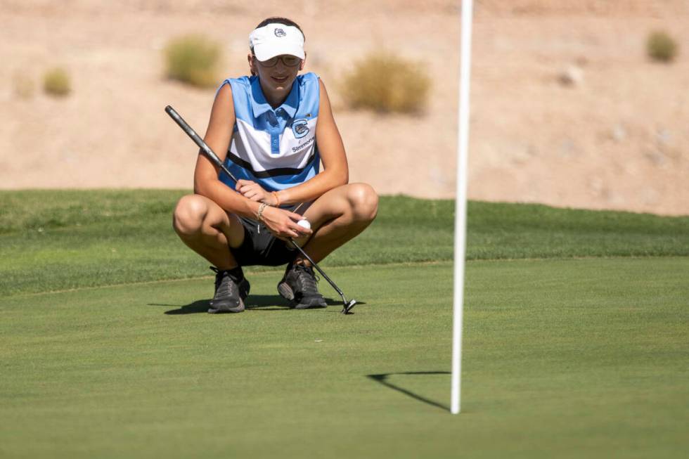 Centennial’s Riley Simmons lines up her shot during the 5A Desert League girls golf matc ...