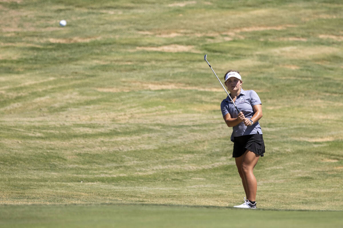 Faith Lutheran’s Alisi Johnston chips her ball toward the green during the 5A Desert Lea ...