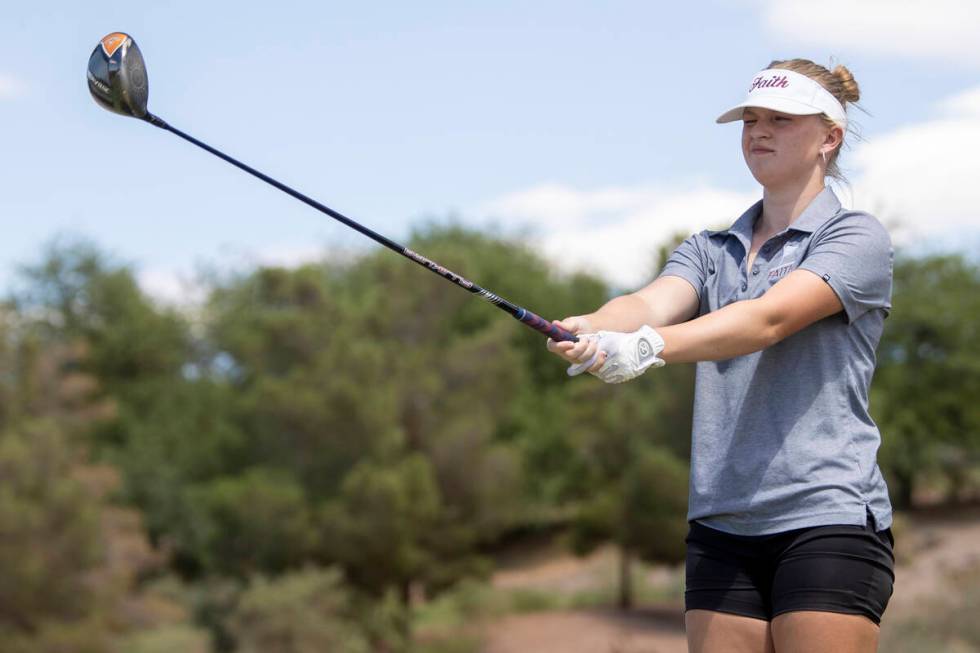 Faith Lutheran’s Lisa Harding lines up her shot during the 5A Desert League girls golf m ...