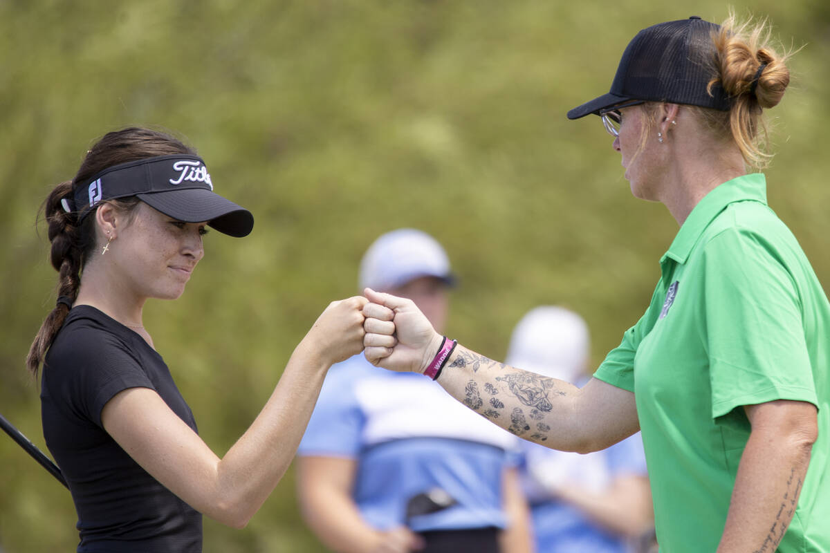 Palo Verde’s Hannah Berry, left, fist-bumps Head Coach Kelly Glass, right, after driving ...