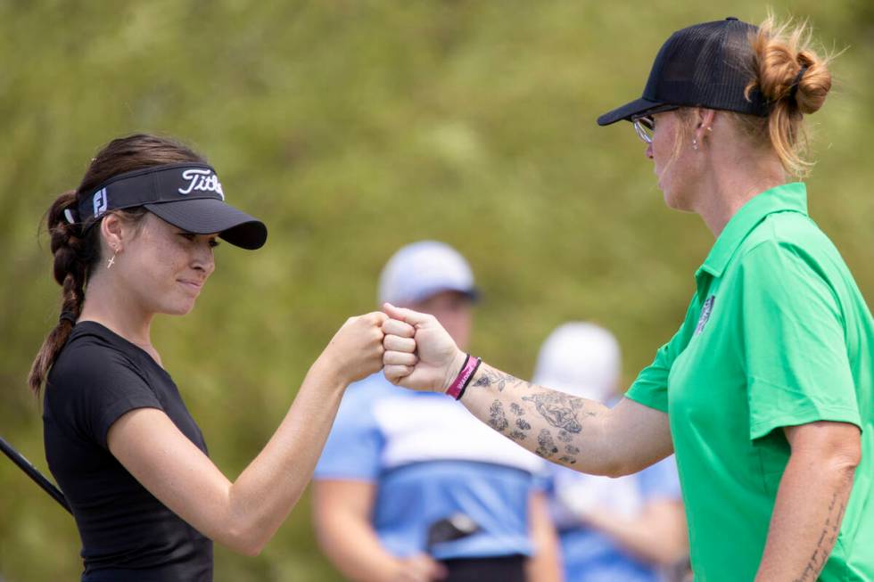 Palo Verde’s Hannah Berry, left, fist-bumps Head Coach Kelly Glass, right, after driving ...