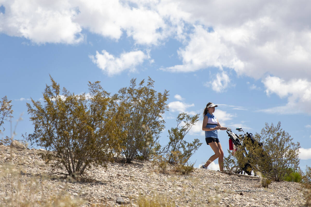 Centennial’s Mia Meyers begins to walk to her ball during the 5A Desert League girls gol ...