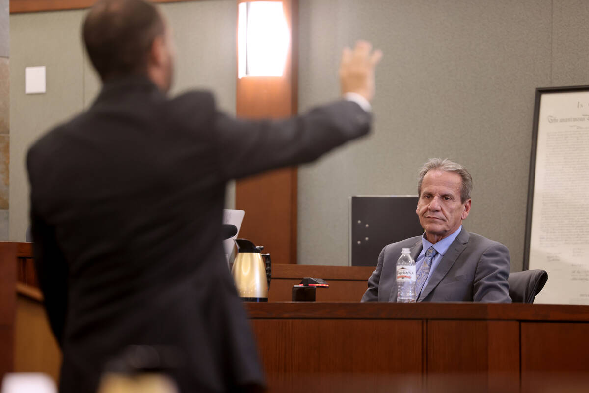 Chief Deputy District Attorney Christopher Hamner, left, questions Robert Aguero, defense witne ...