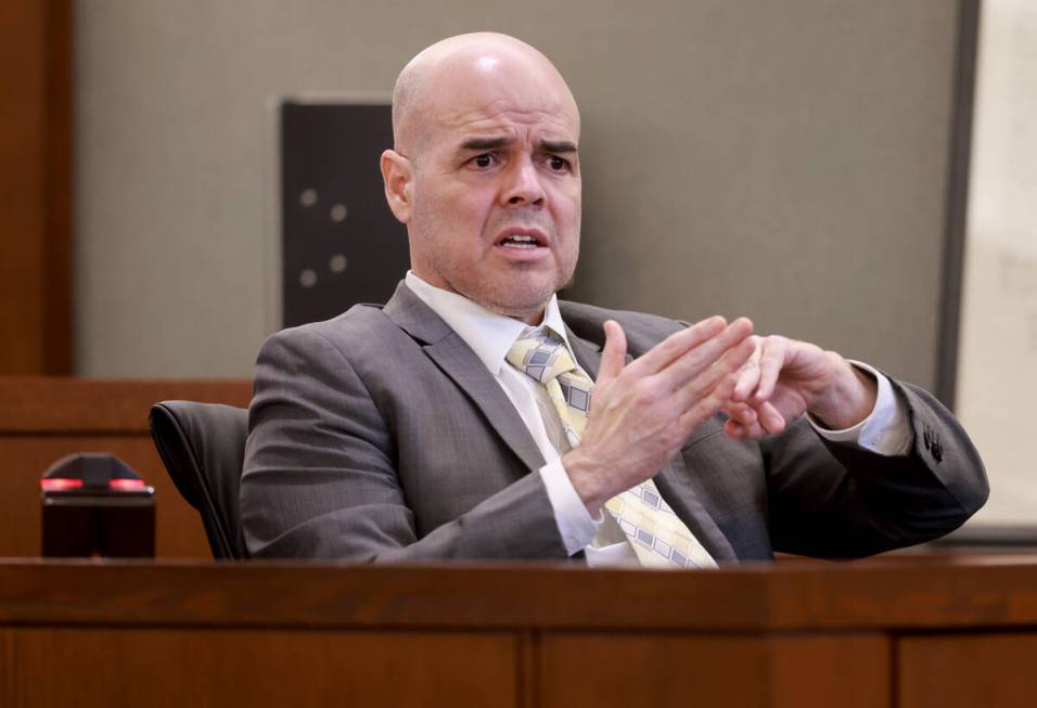 Robert Telles shows how he cut his finger while speaking to the jury from the witness stand on ...