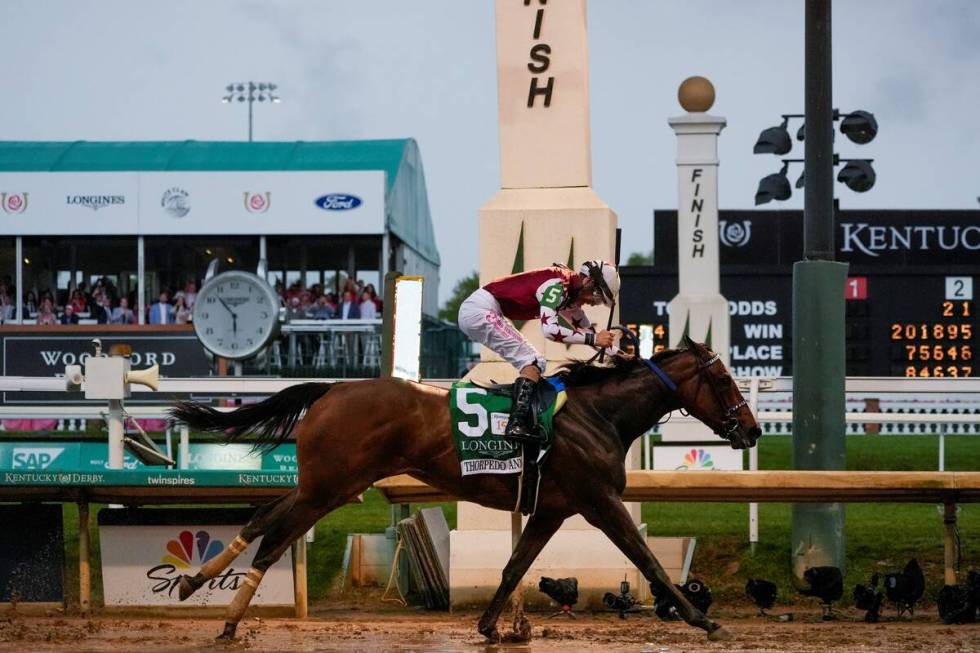 Brian Hernandez Jr. rides Thorpedo Anna (5) to win the 150th running of the Kentucky Oaks horse ...