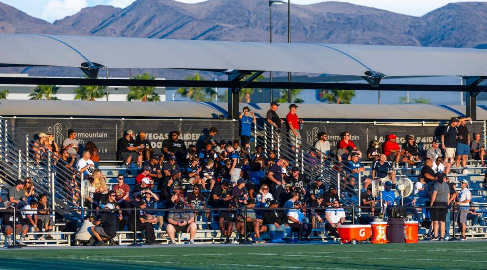 Raiders alumni and their families watch practice at the Intermountain Health Performance Center ...