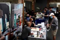 Prospective employers and job seekers interact during during a job fair on Sept. 22, 2021, in t ...