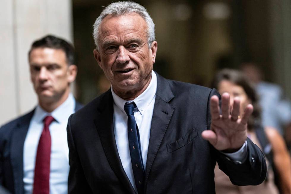 Independent presidential candidate Robert F. Kennedy Jr., waves to the media outside the Nassau ...