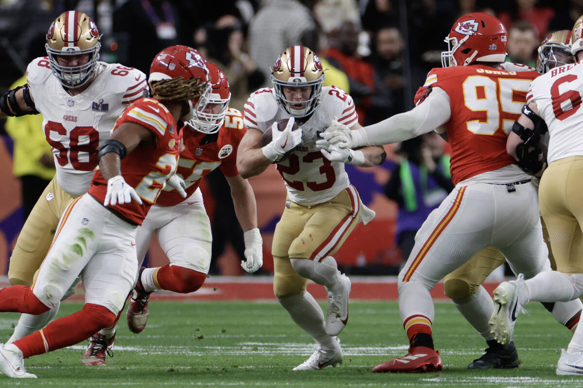 San Francisco 49ers running back Christian McCaffrey (23) breaks through the Kansas City Chiefs ...