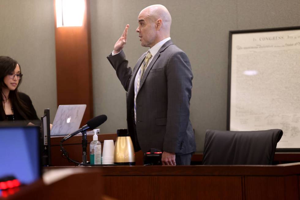 Robert Telles is sworn in on the witness stand on the eighth day of his murder trial at the Reg ...