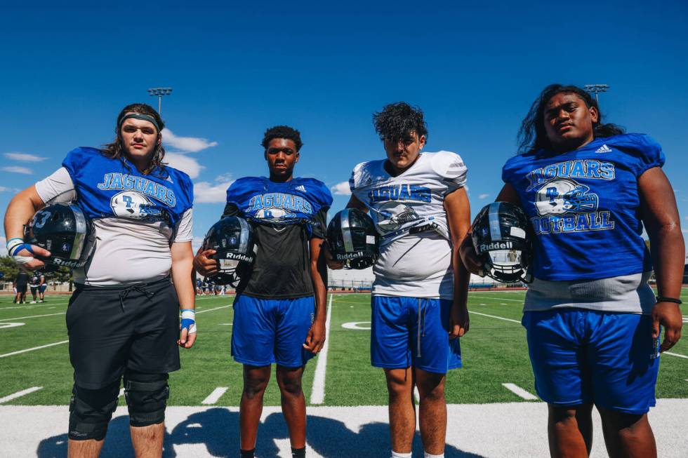 Desert Pines football players Gabe Gough, from left, Zasean Washington, Aidan Barbosa and Raysh ...