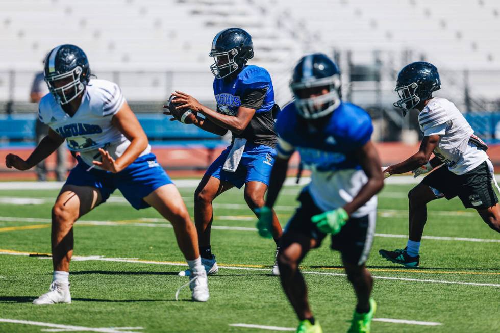 Desert Pines players run a drill during a practice at Desert Pines High School on Wednesday, Au ...