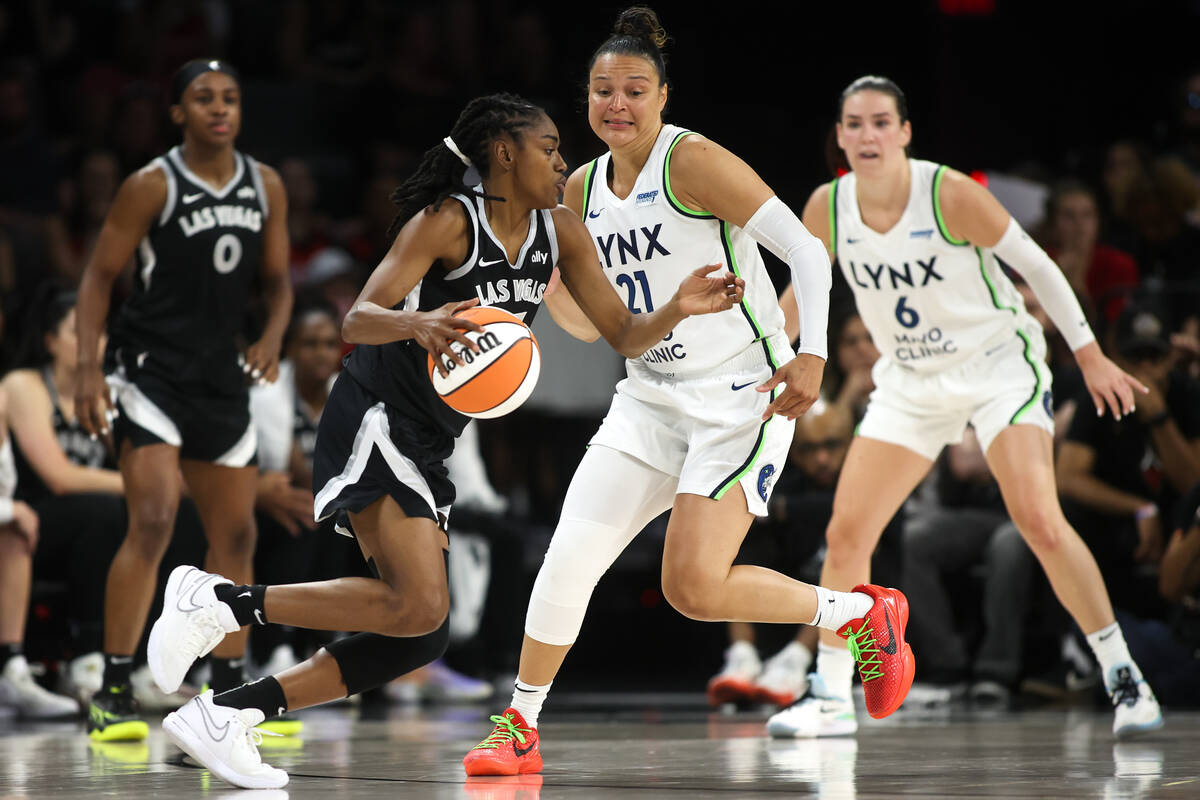 Las Vegas Aces guard Tiffany Hayes, center left, dribbles against Minnesota Lynx guard Kayla Mc ...