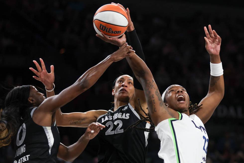 Minnesota Lynx forward Myisha Hines-Allen, right, shoots while Las Vegas Aces guard Jackie Youn ...