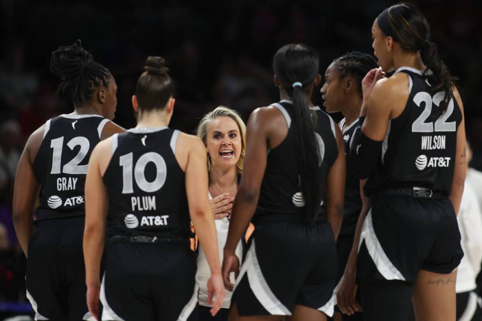 Las Vegas Aces head coach Becky Hammon speaks to her team in a timeout during the second half o ...