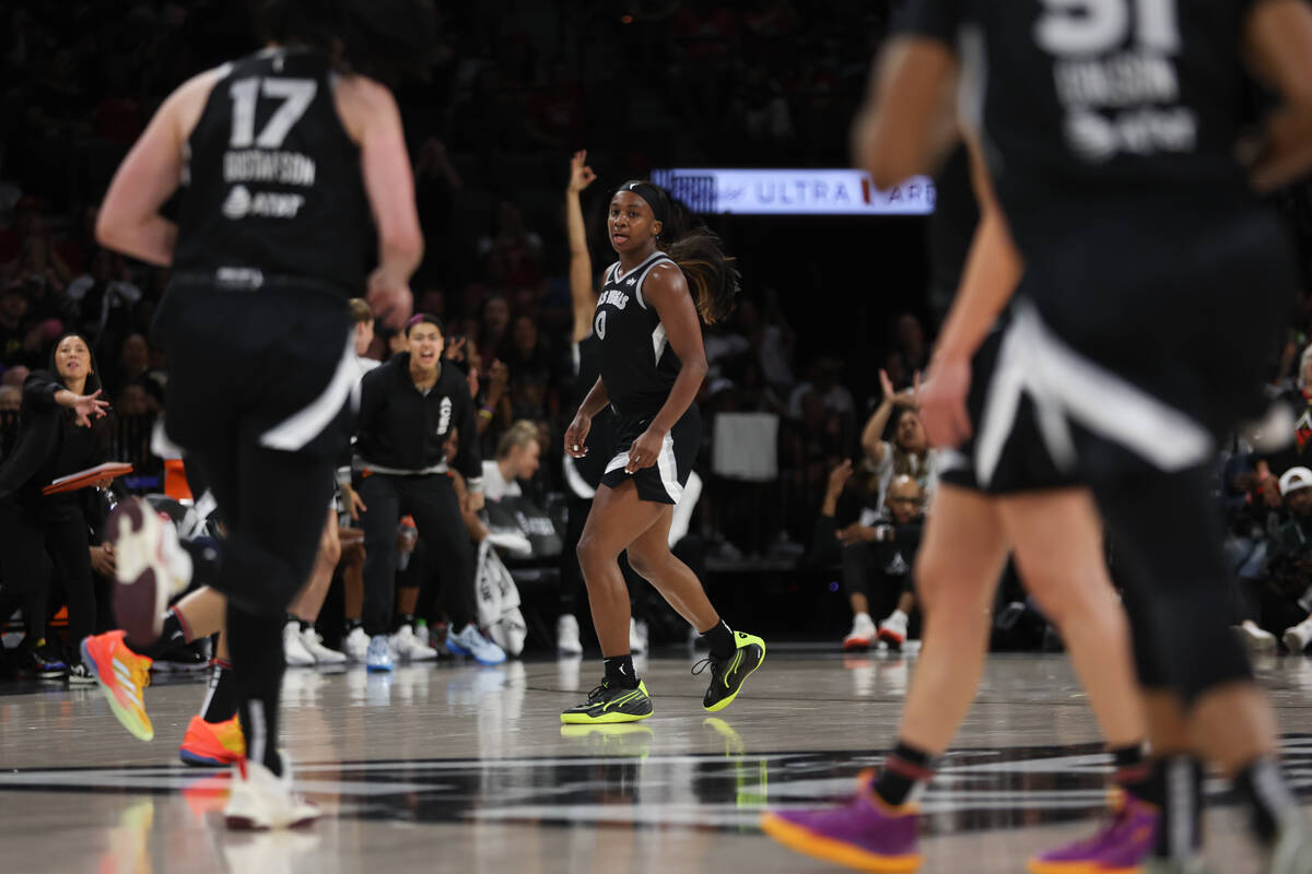 Las Vegas Aces guard Jackie Young (0) reacts after scoring a three-point basket during the seco ...