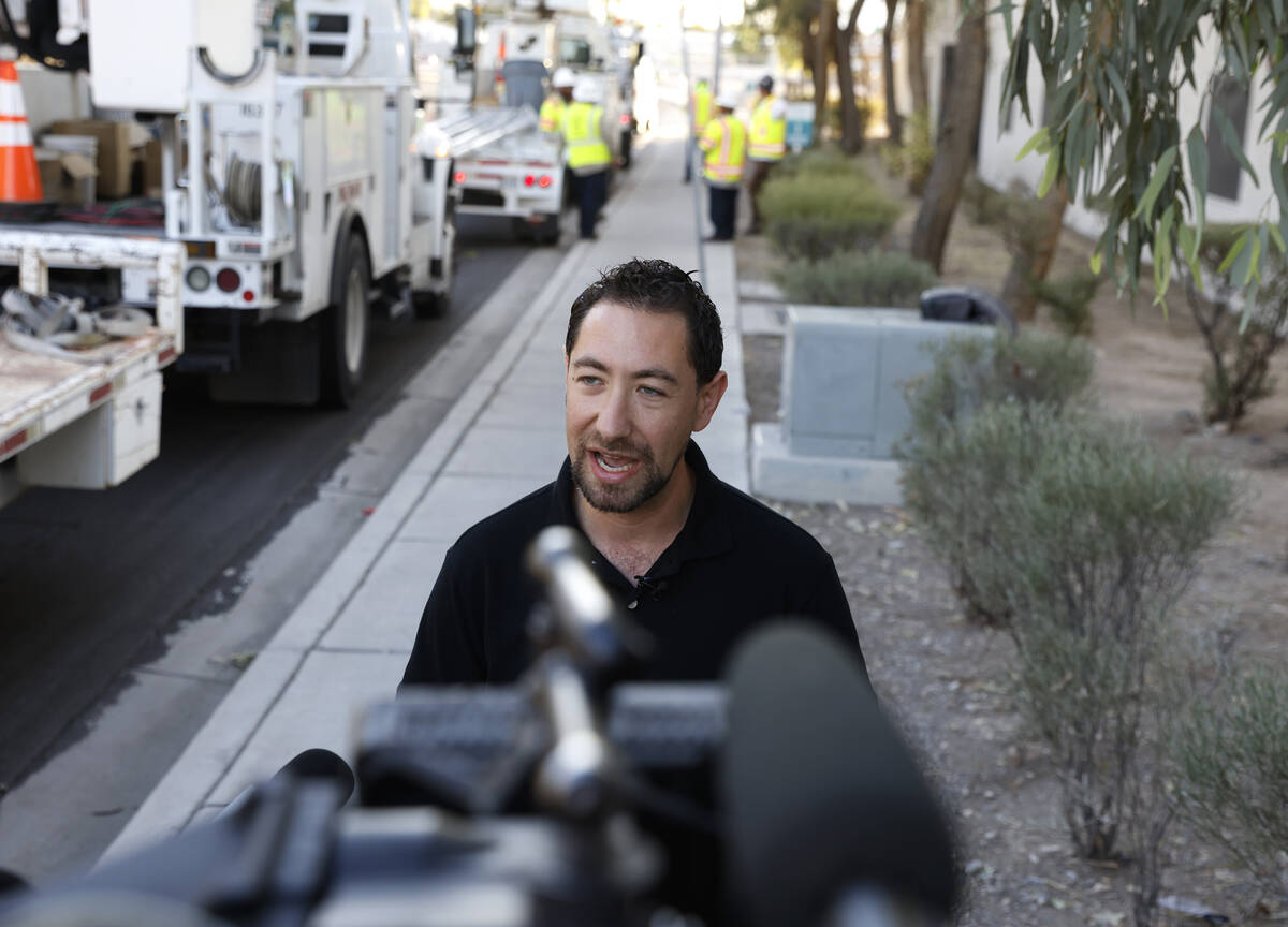 Commissioner Michael Naft addresses the media as Public Works crews install one of the 12 new s ...