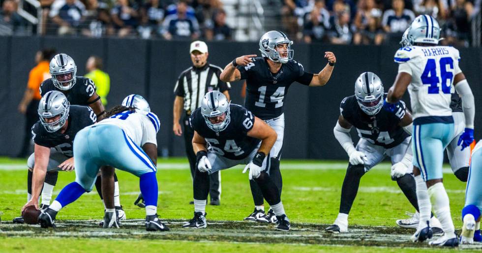 Raiders quarterback Carter Bradley (14) signals to his teammates against the Dallas Cowboys dur ...