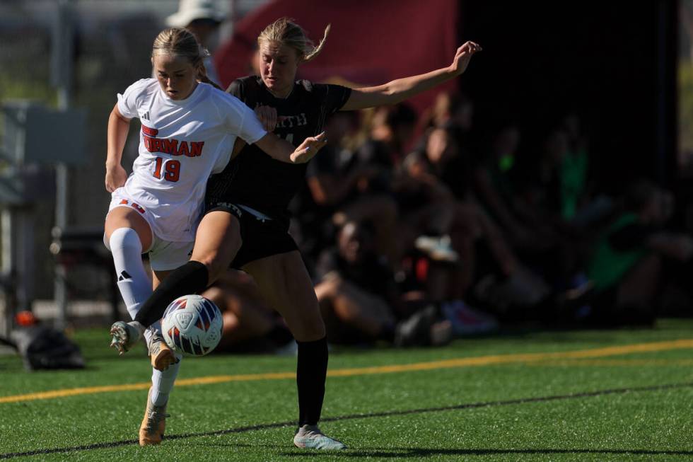 Bishop Gorman’s Riley Rohr (19) vies for the ball against Faith Lutheran’s Kloe A ...