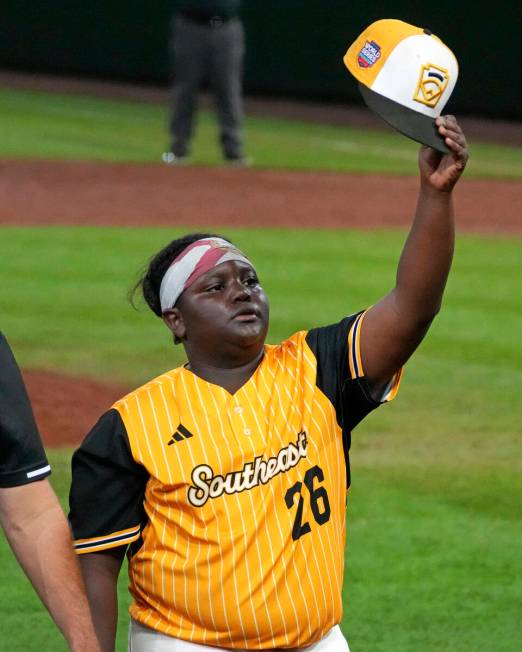 Lake Mary, Fla.'s Teraj Alexander waves to fans as he walks to the dugout after pitching during ...