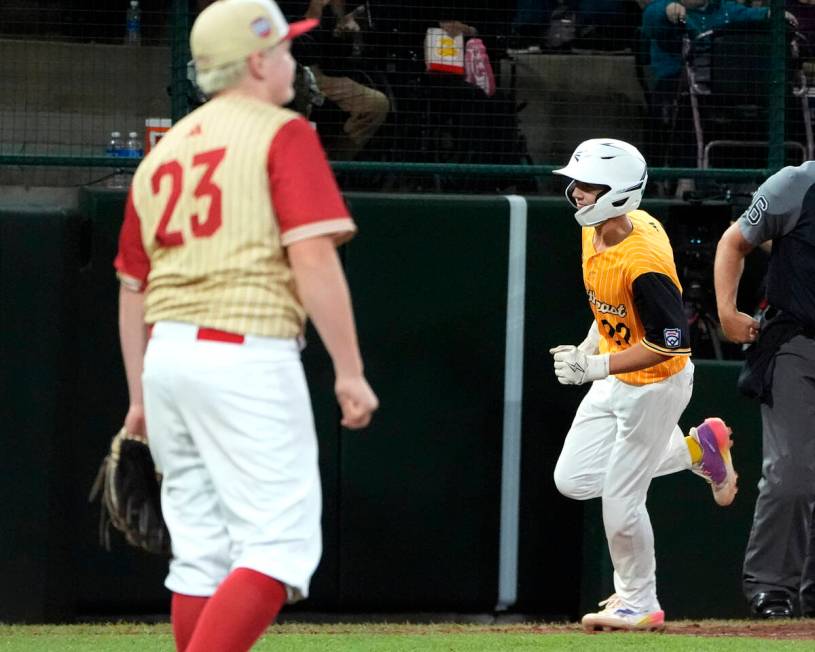 Lake Mary, Fla.'s Garrett Rohozen (22) rounds third base on his home run off Henderson, Nev. pi ...