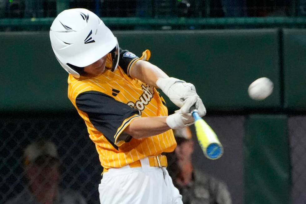 Lake Mary, Fla.'s Garrett Rohozen connects with a throw from Henderson, Nev., pitcher Oliver Jo ...