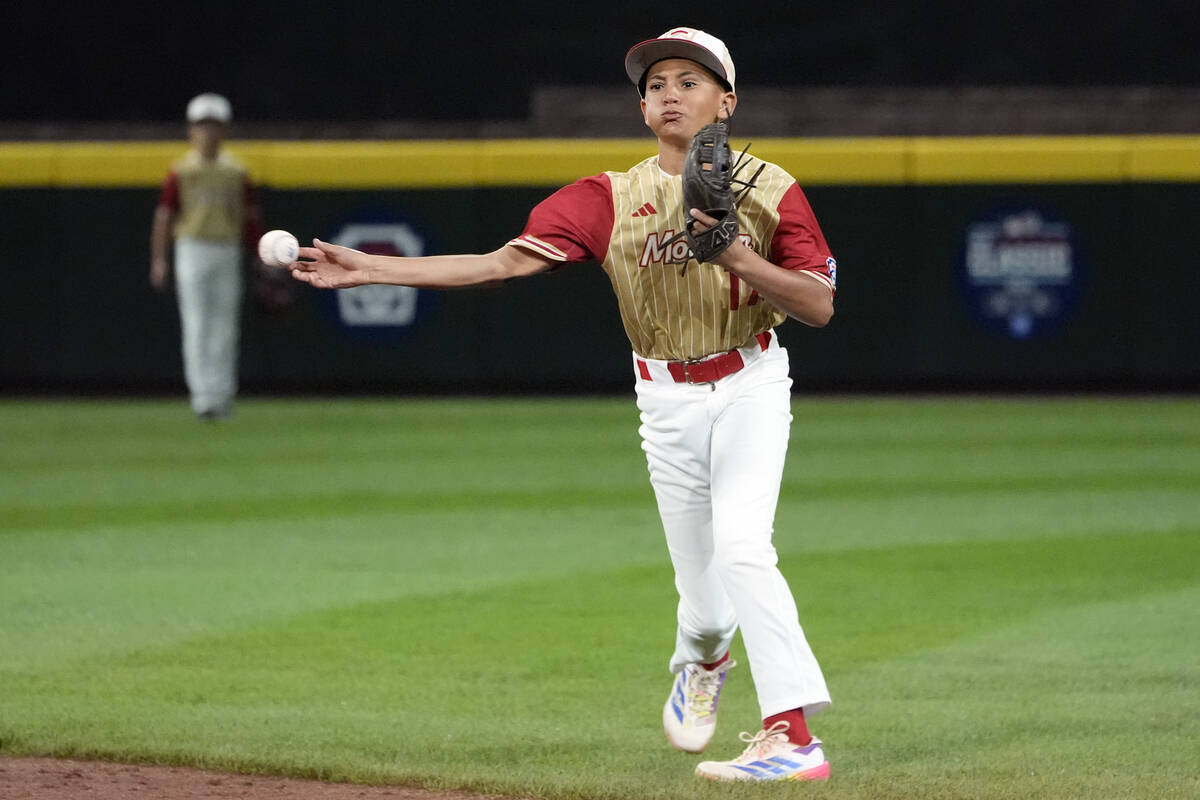 Henderson, Nev., shortstop Russell McGee throws out Lake Mary, Fla.'s James Feliciano on a ball ...