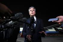 U.S. Secretary of State Antony Blinken speaks to reporters on the tarmac in Doha, Qatar, on Aug ...