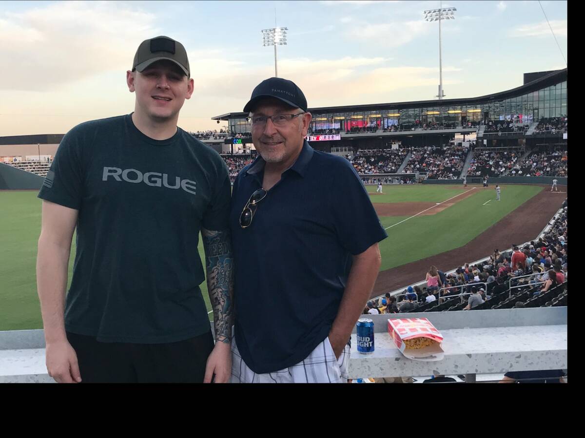 Blaine Sullivan, left, shown with his father, Curt, will throw out the first pitch Friday befor ...