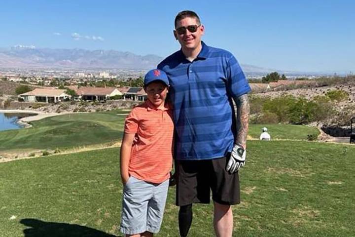 Blaine Sullivan, shown with son John, 10, will throw out the first pitch Friday before the Los ...