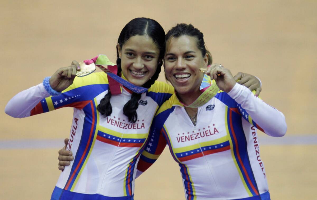 Venezuela's Mariestela Vilera, left, and Daniela Larreal celebrate after won gold medal in a cy ...