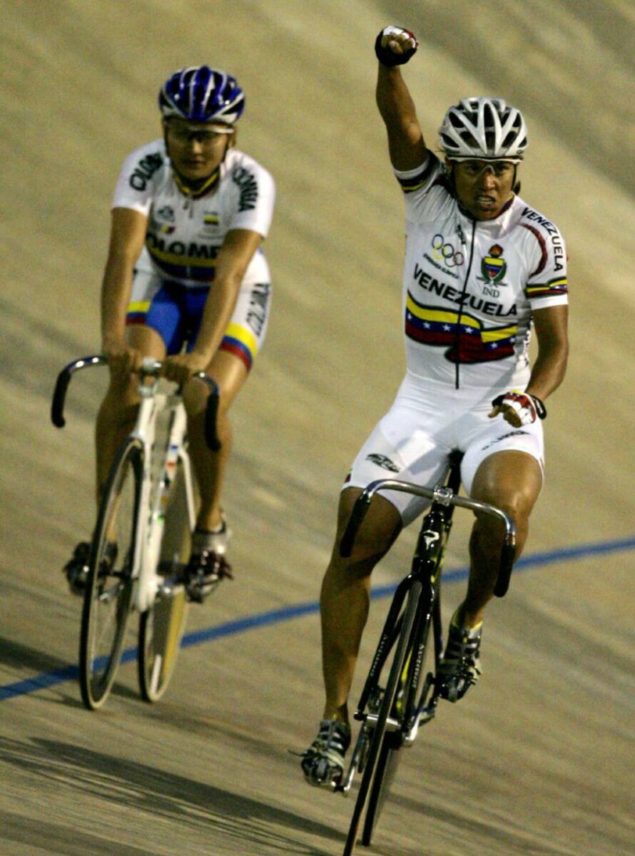 Venezuela's Daniela Larreal Chirinos, right, reacts after winning the gold medal in the sprint ...