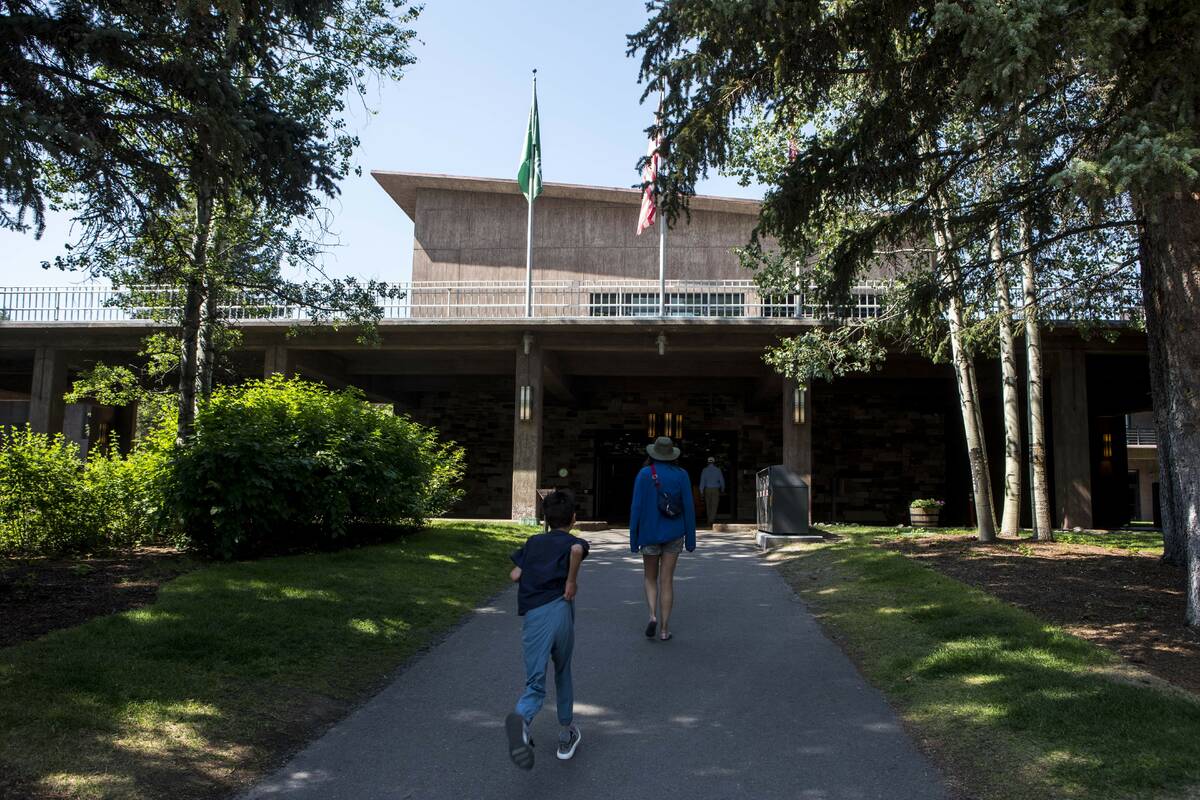 Guests approach Jackson Lake Lodge, the site of the Jackson Hole Economic Symposium, in Grand T ...