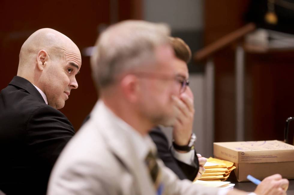 Robert Telles, left, listens with his attorneys Michael Horvath, right, and Robert Draskovich d ...