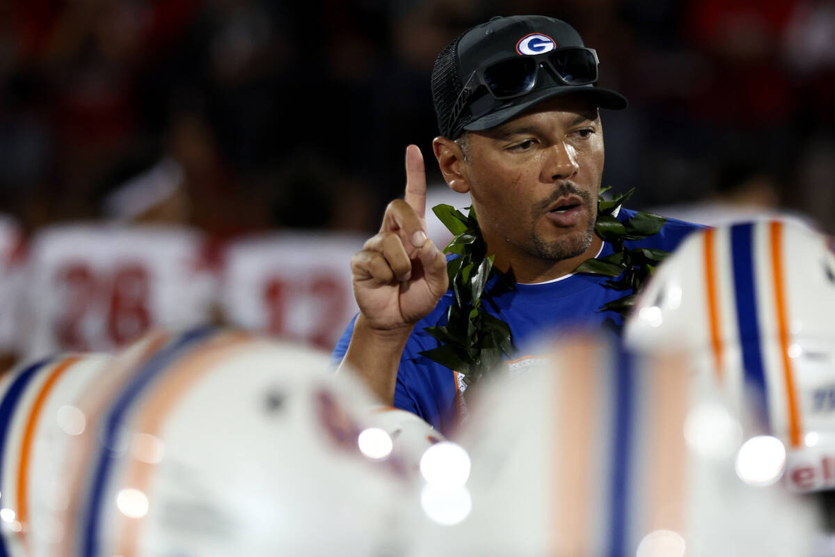 Bishop Gorman head coach Brent Browner talks to his team after they won a high school football ...