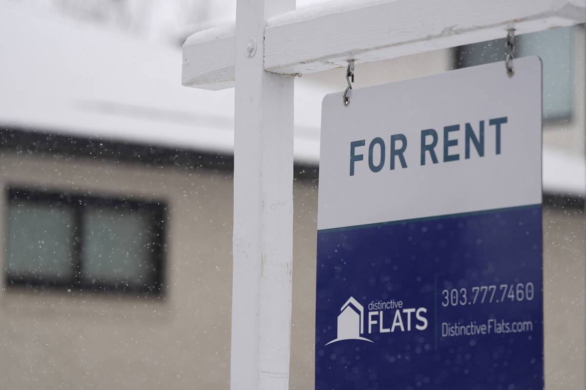 FILE - A for rent sign stands outside a single-family home on the market Saturday, Feb. 10, 202 ...