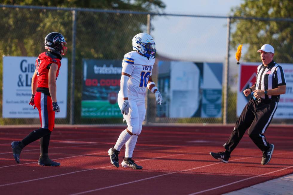 A referee flags Coronado safety/wide receiver Ayden Ditto (17) for unnecessary roughness agains ...