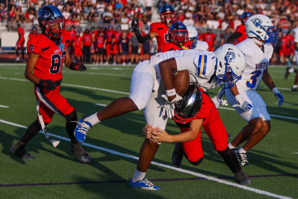 Sierra Vista wide receiver Dasani Ross (19) loses his balance as Coronado safety Caden Erickson ...