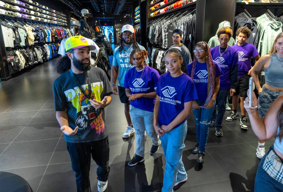 Tour guide Gio Peralte, left, shows teens from the Boys & Girls Clubs of Southern Nevada an ...