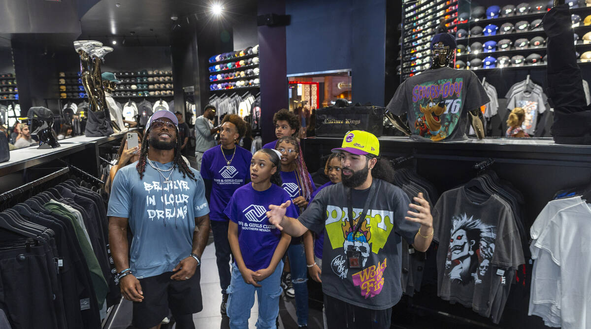 (From right) Tour guide Gio Peralte shows teens from the Boys & Girls Clubs of Southern Nev ...