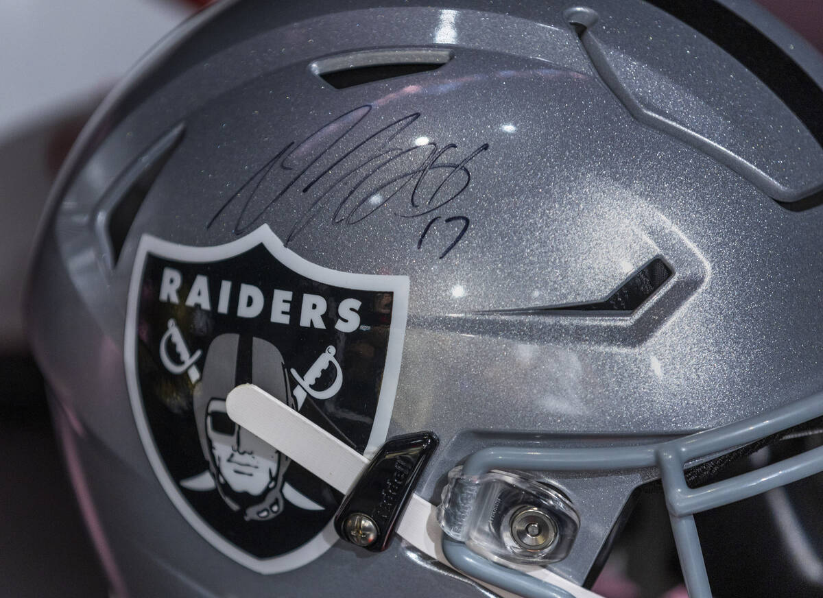 A signed helmet from Raiders wide receiver Davante Adams (17) is an item on display at Culture ...