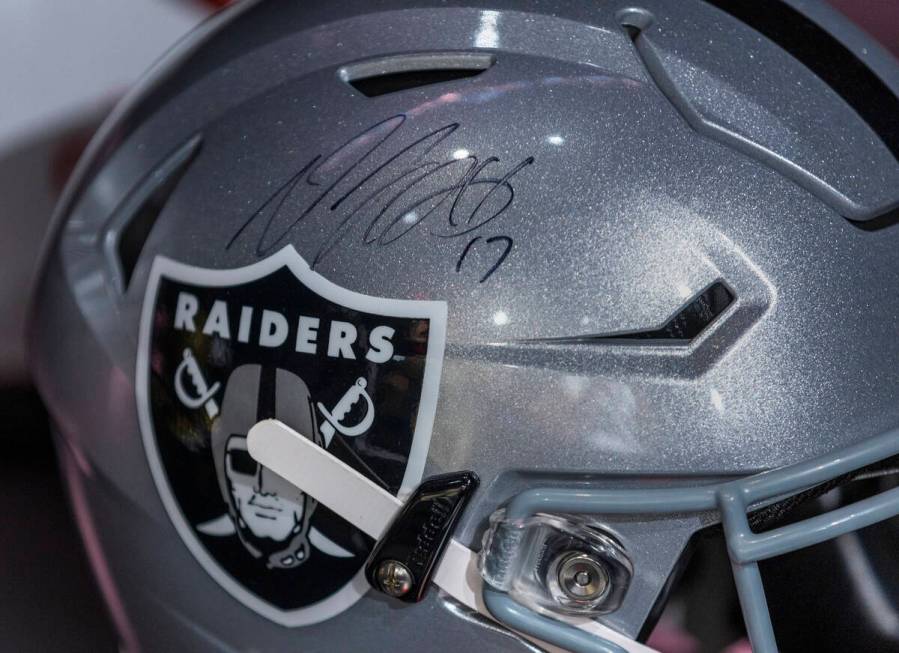 A signed helmet from Raiders wide receiver Davante Adams (17) is an item on display at Culture ...